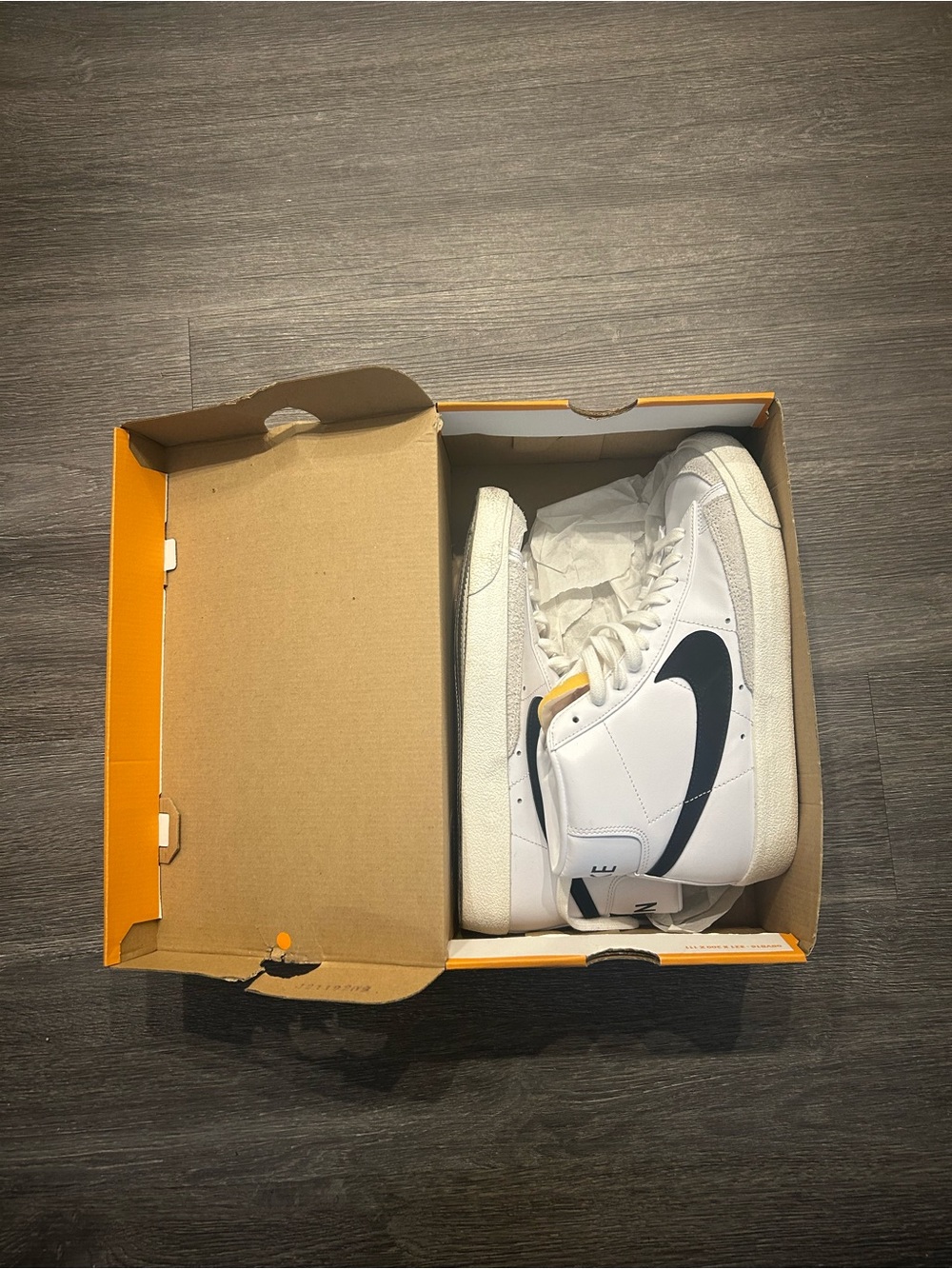 Nike White High-Top Sneakers with Black Swoosh